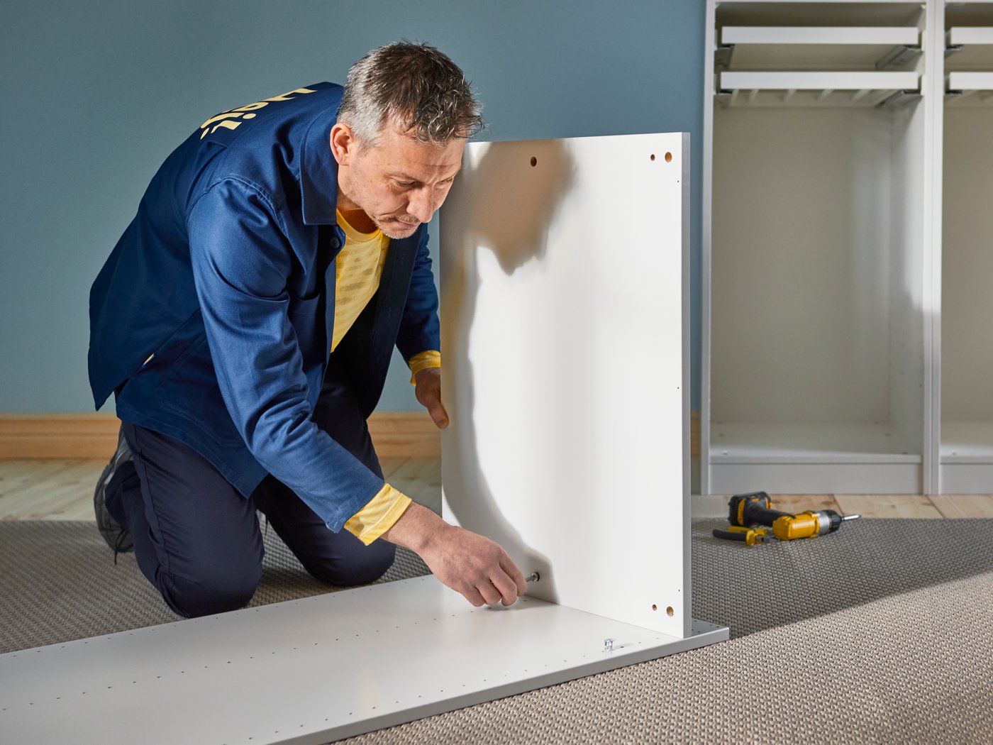 A person is assembling a piece of furniture