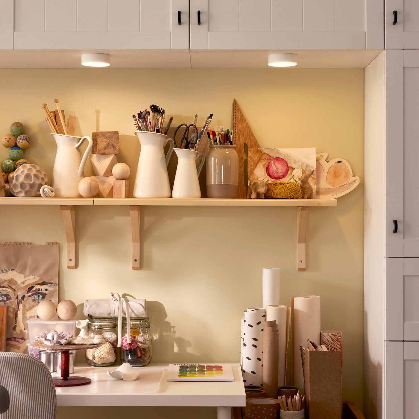 BESTÅ storage is mounted on the wall around a LAGKAPTEN/ADILS desk and two TRANHULT/SANDSHULT wall shelves.