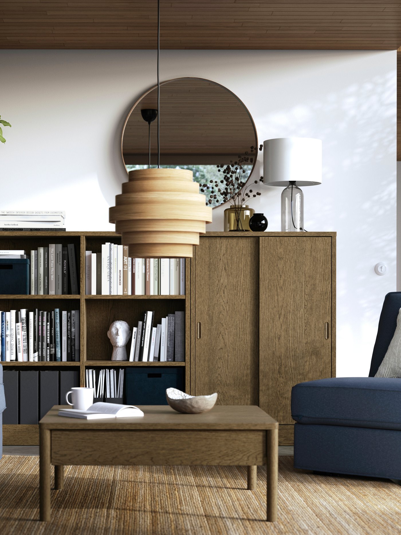 Living room with a brown TONSTAD cabinet and shelving unit by the wall and a sofa in the foreground.