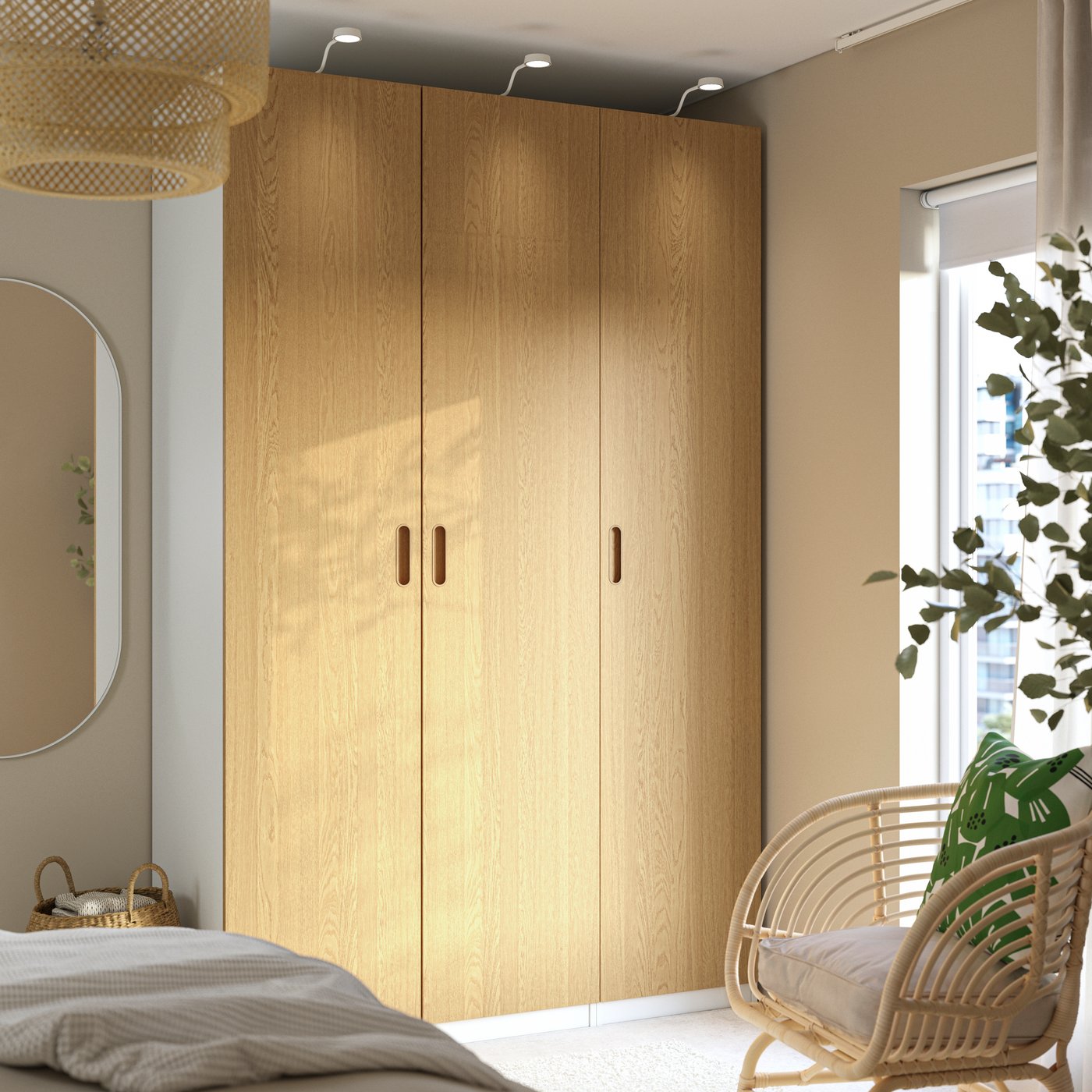 A white/oak veneer PAX wardrobe combination in the bedroom