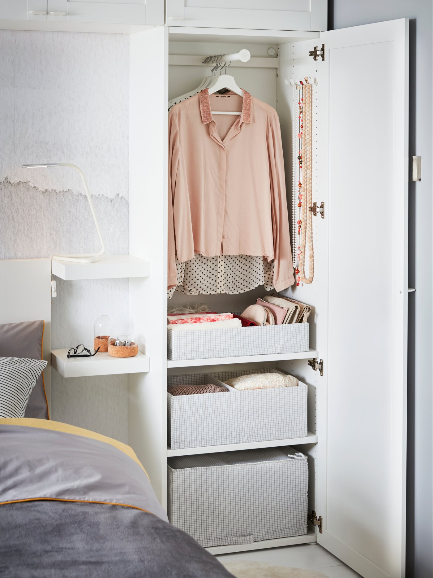 A white/grey STUK box with compartments in the bedroom