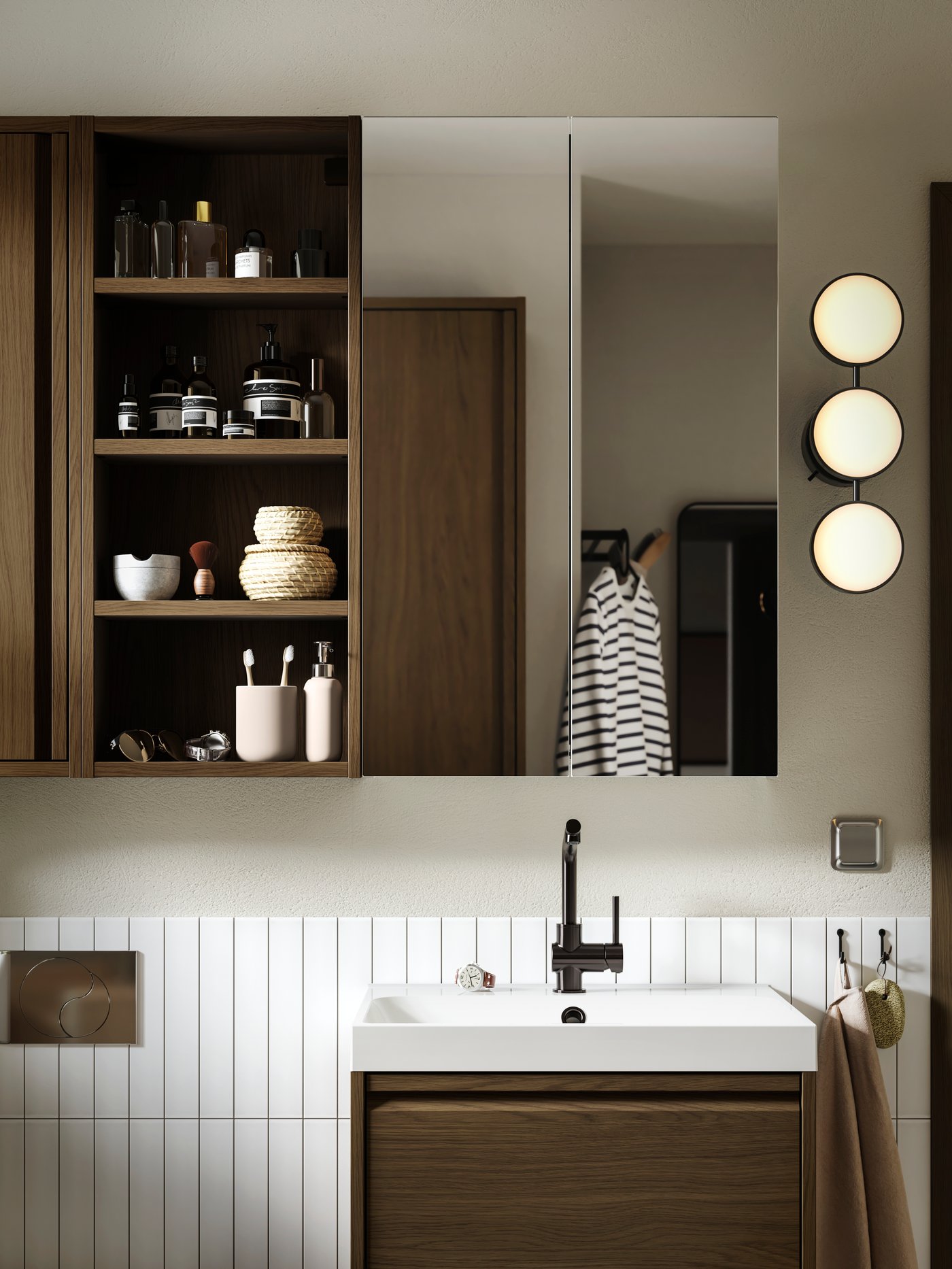 A bathroom wall with a HAGAÅN wall open cabinet with a brown oak effect and a LETTAN mirror cabinet with door.