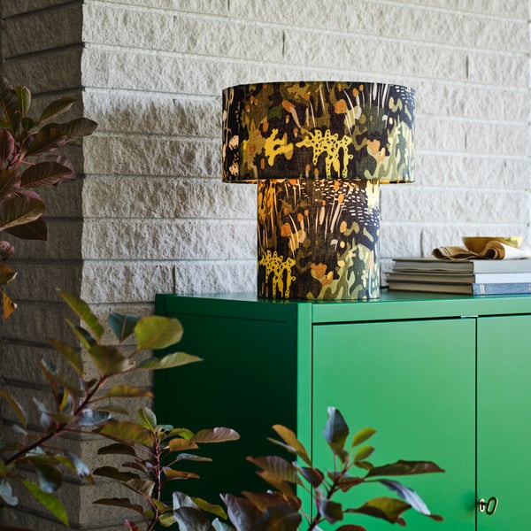A green STOCKHOLM 2025 cabinet with 2 doors
