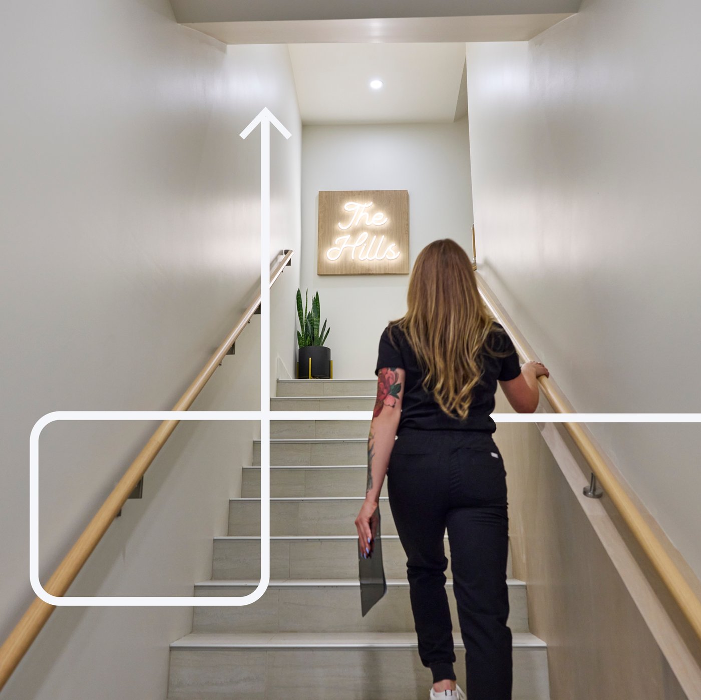 A women is walking up the stairs