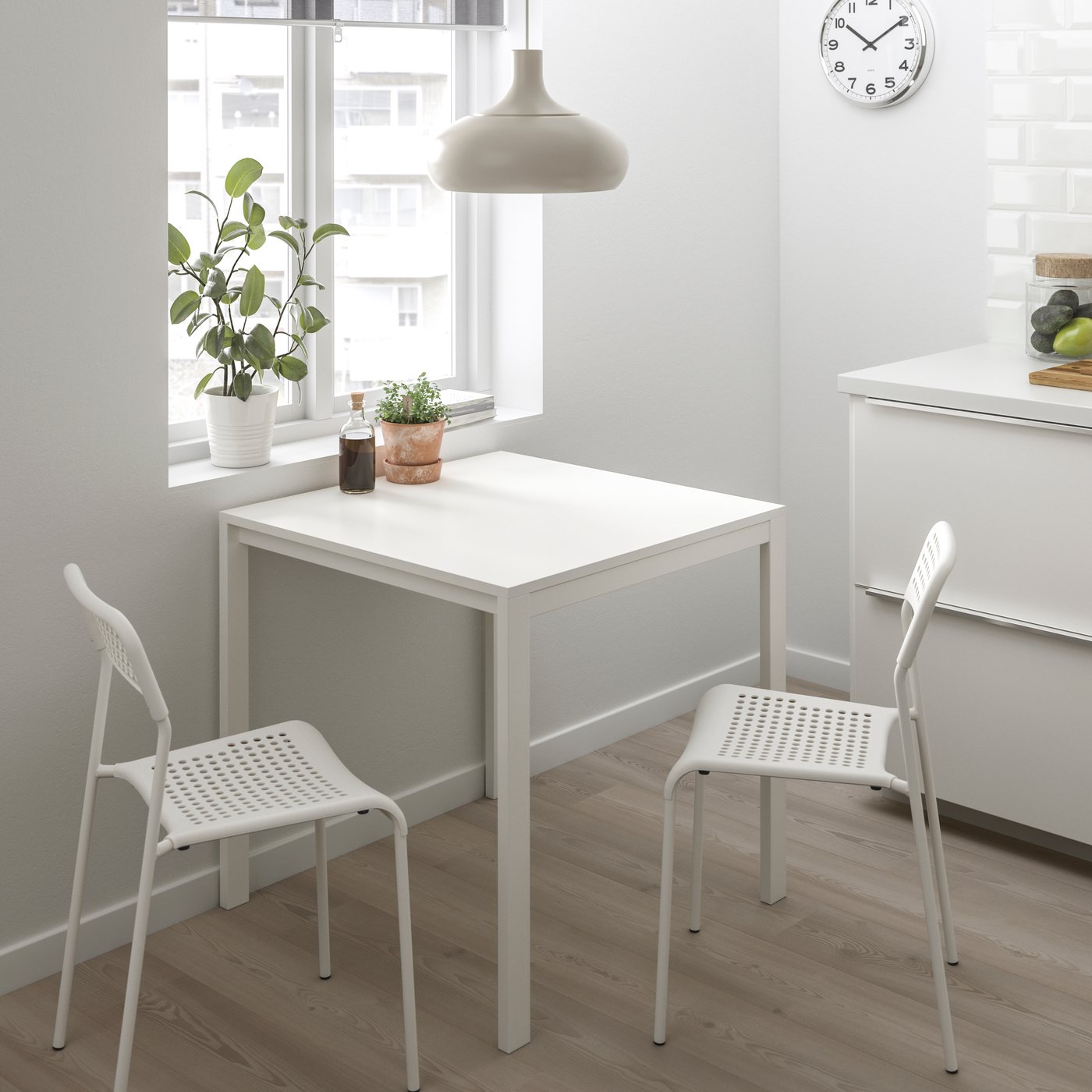 A white MELLTORP table and 2 chairs