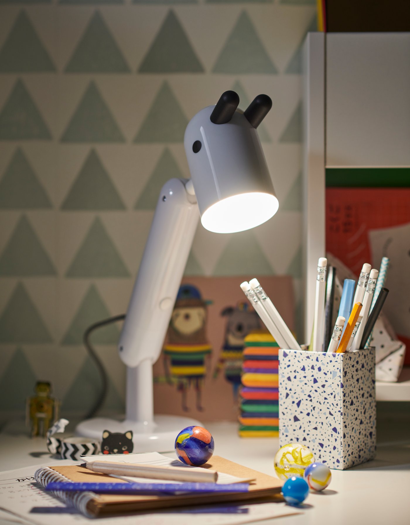 A white KRUX LED work lamp in the childrens room