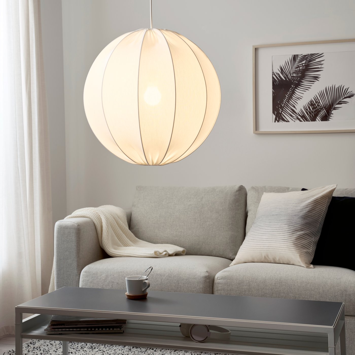 A round white REGNSKUR pendant lampshade
