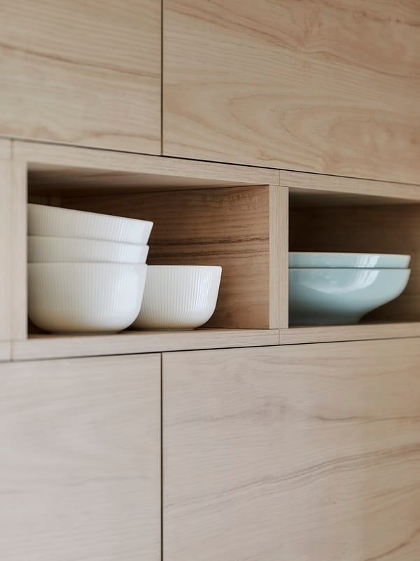 IKEA METOD ASKERSUND smooth wooden ash-effect cabinet fronts with two open inserts used for storing tableware.