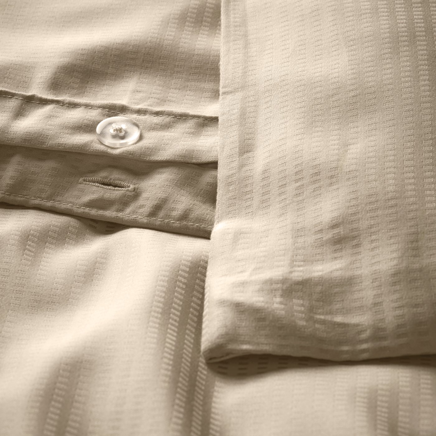 A beige LÄKEVÄNDEROT duvet cover and pillowcase
