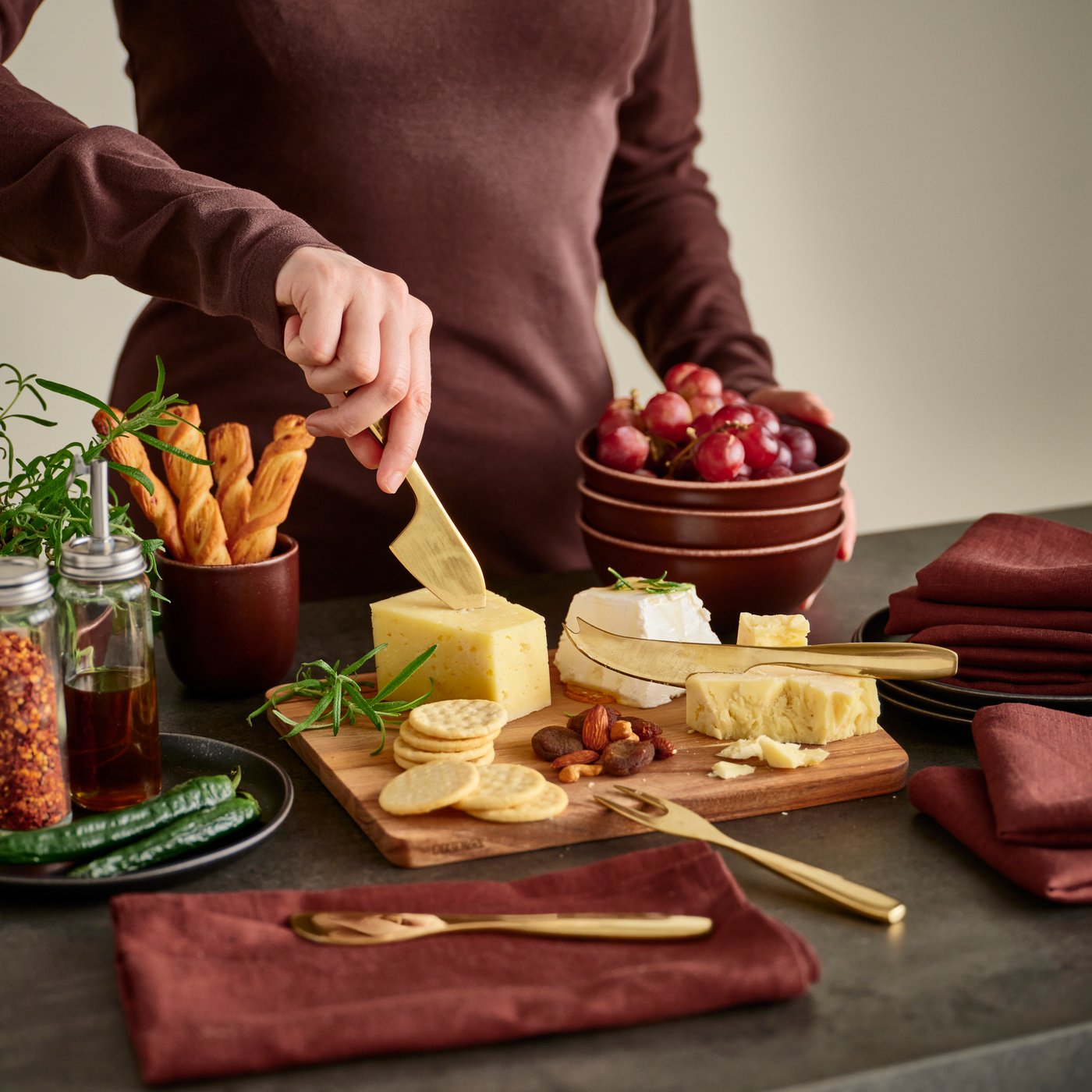 A brass-colour TILLAGD cheese knife