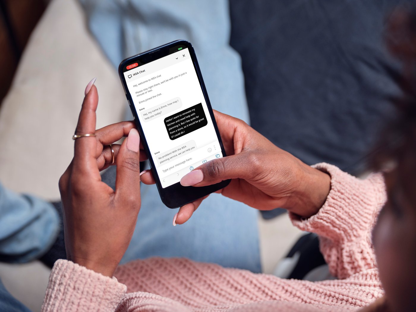 Woman using the phone to check the status of her enquiry