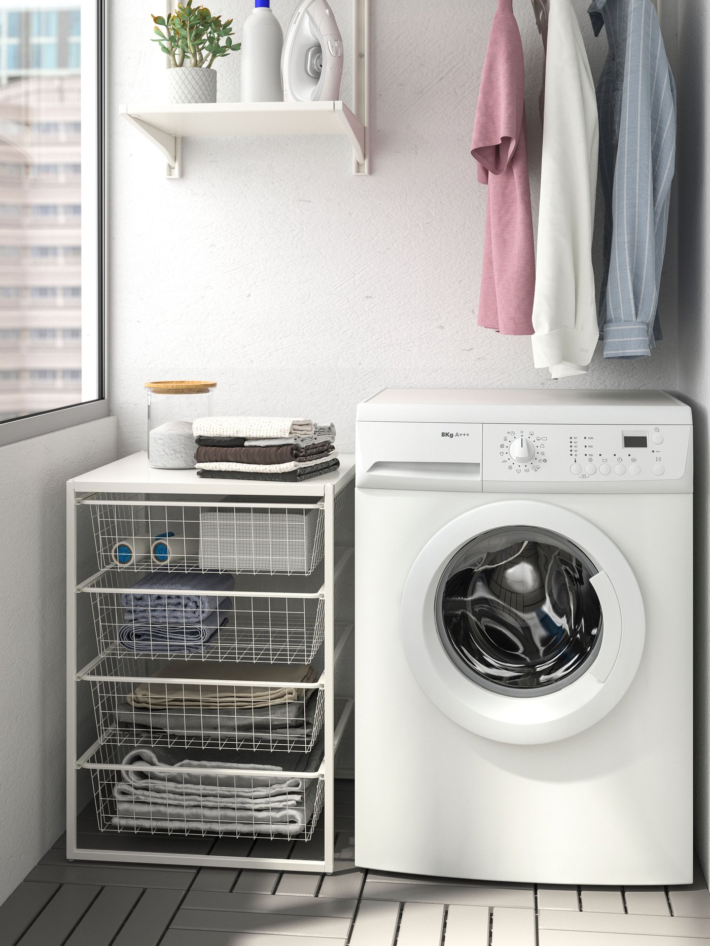 A white JONAXEL storage combination in the laundry room