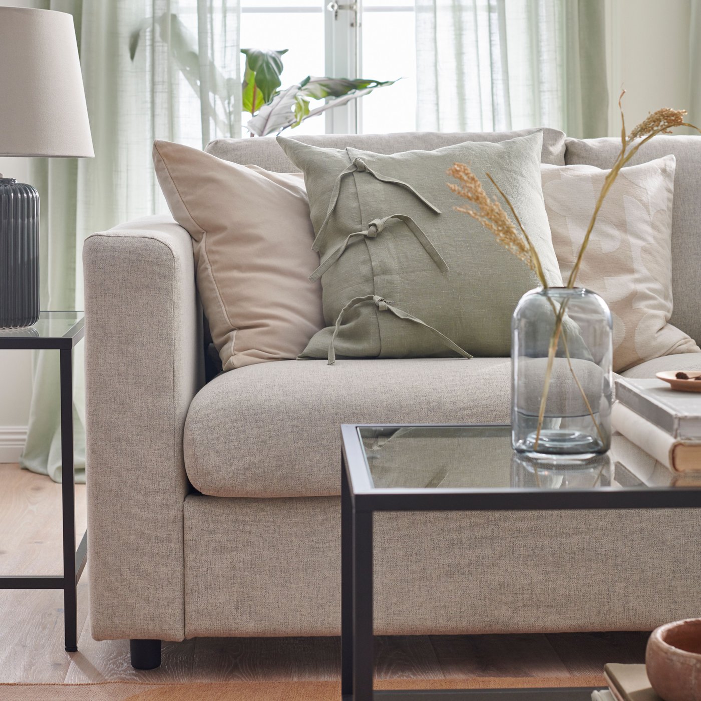 A beige RÖDASK cushion cover in the living room