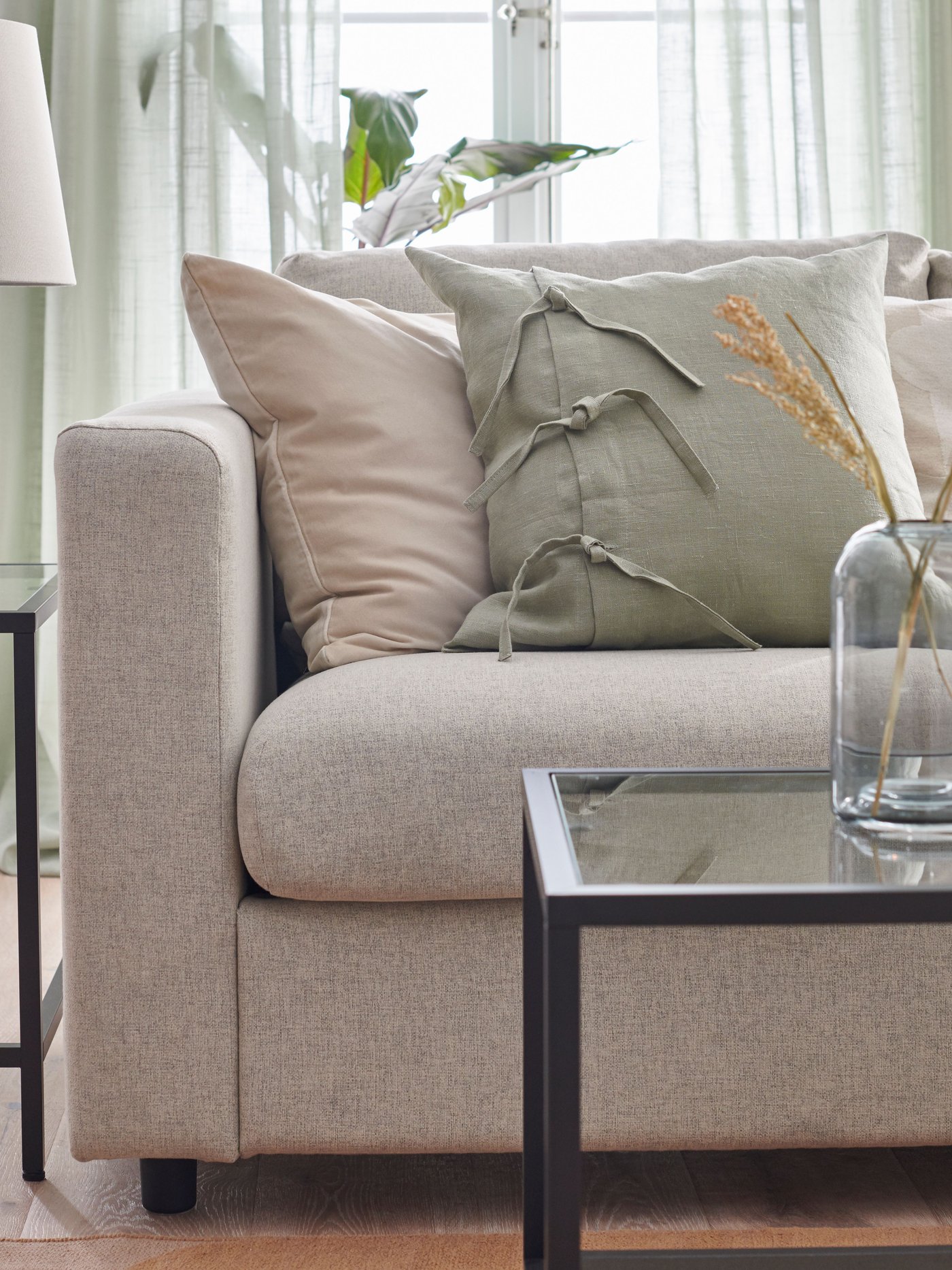 A light green AINA cushion cover in the living room