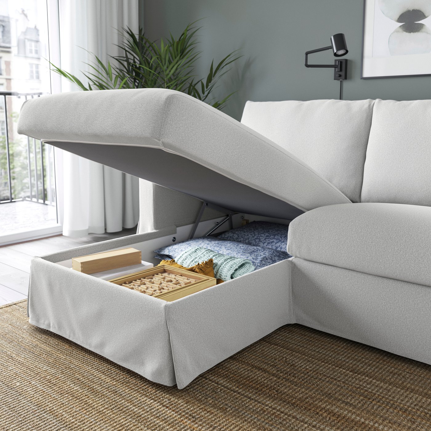 A Tallmyra white/black HYLTARP 3-seat sofa w chaise longue, left in the living room