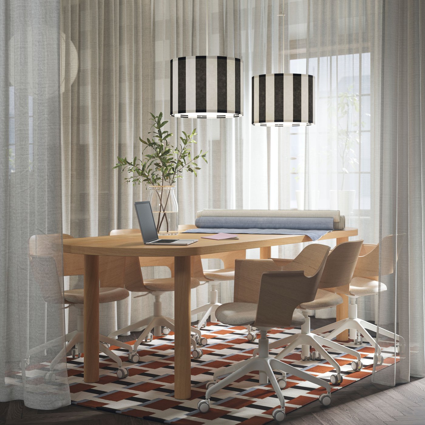 A meeting space with white ÄNGSFRYLE sheer curtains, an oak veneer STOCKHOLM table, and padded conference chairs around it.