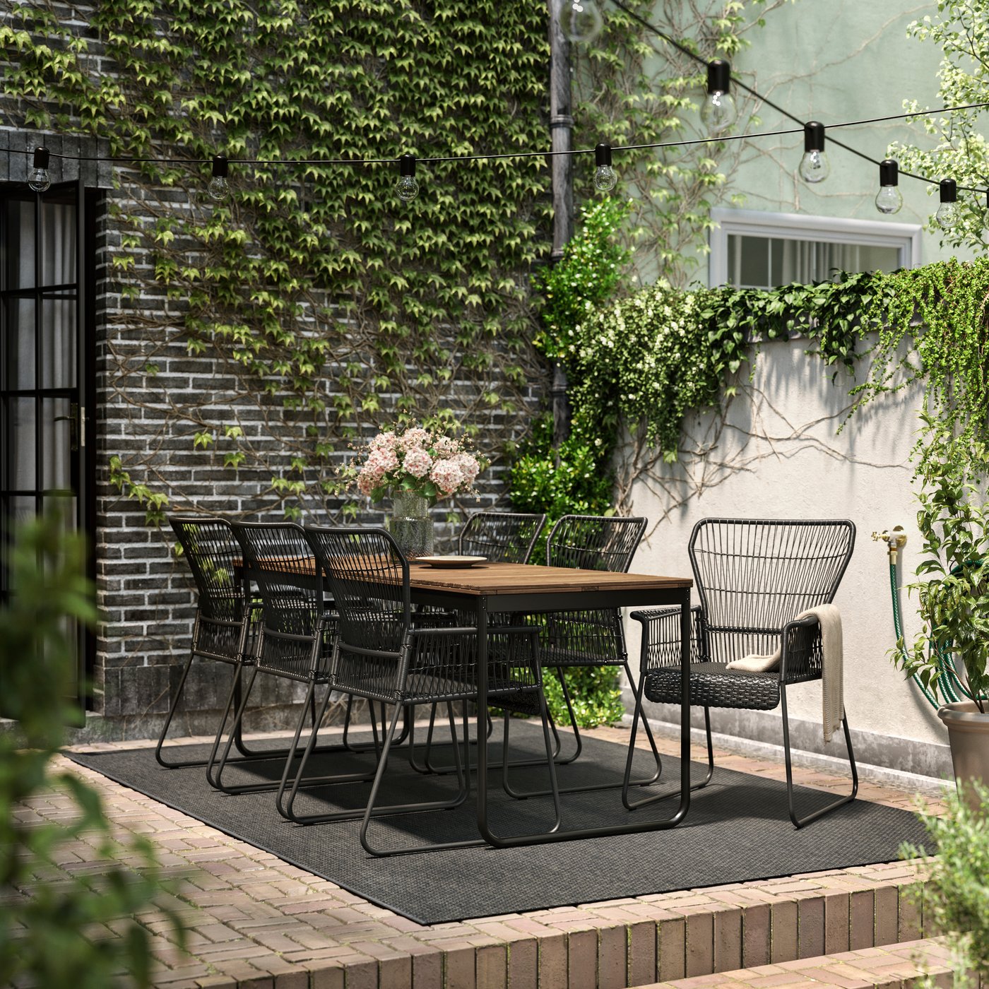 An extendable light brown stained/anthracite TALLSKÄR table+6 chairs w armrests, outdoor