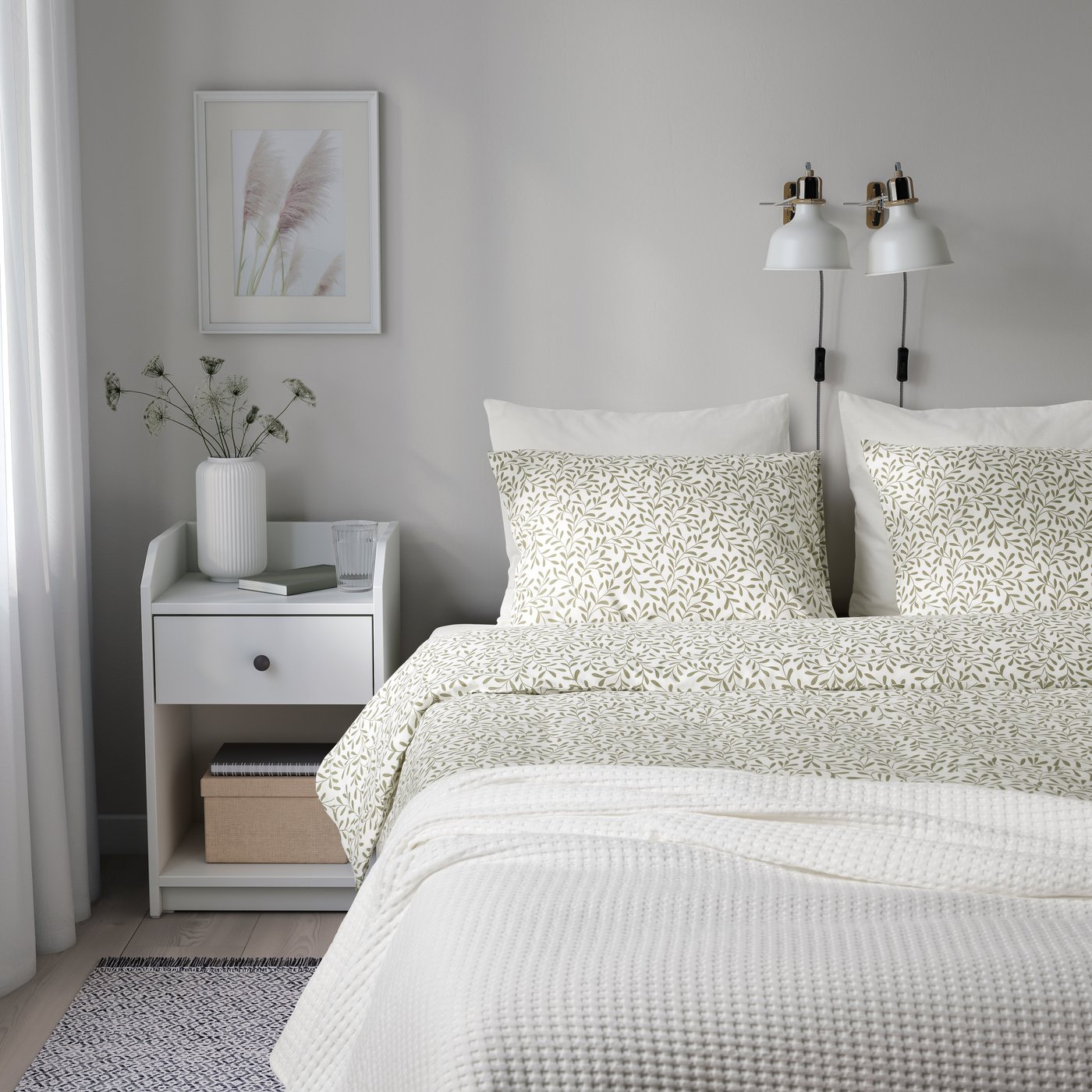 A white/green SORGMANTEL duvet cover and 2 pillowcases in the bedroom