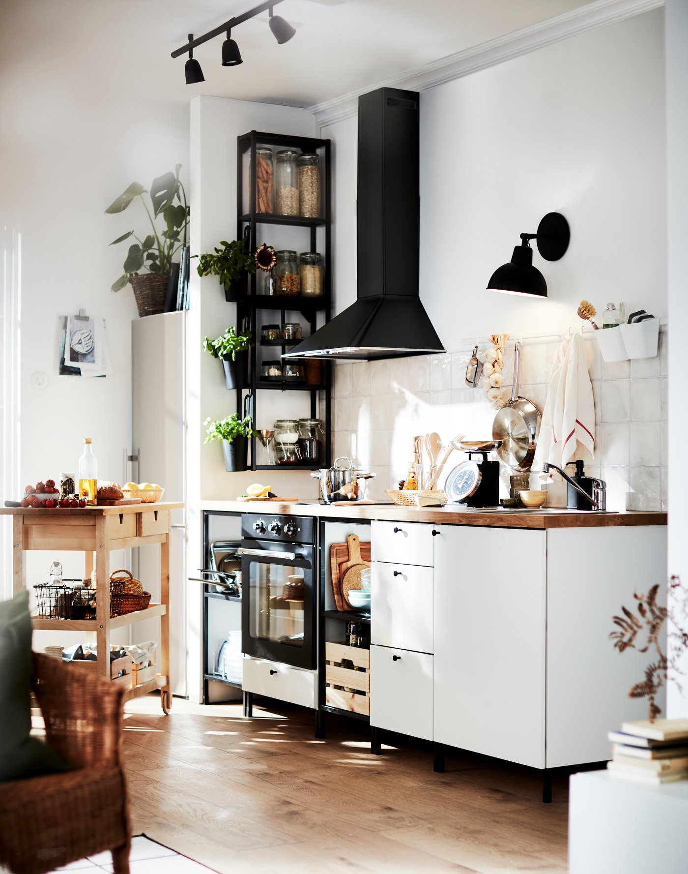 A black MATTRADITION wall mounted extractor hood in the kitchen