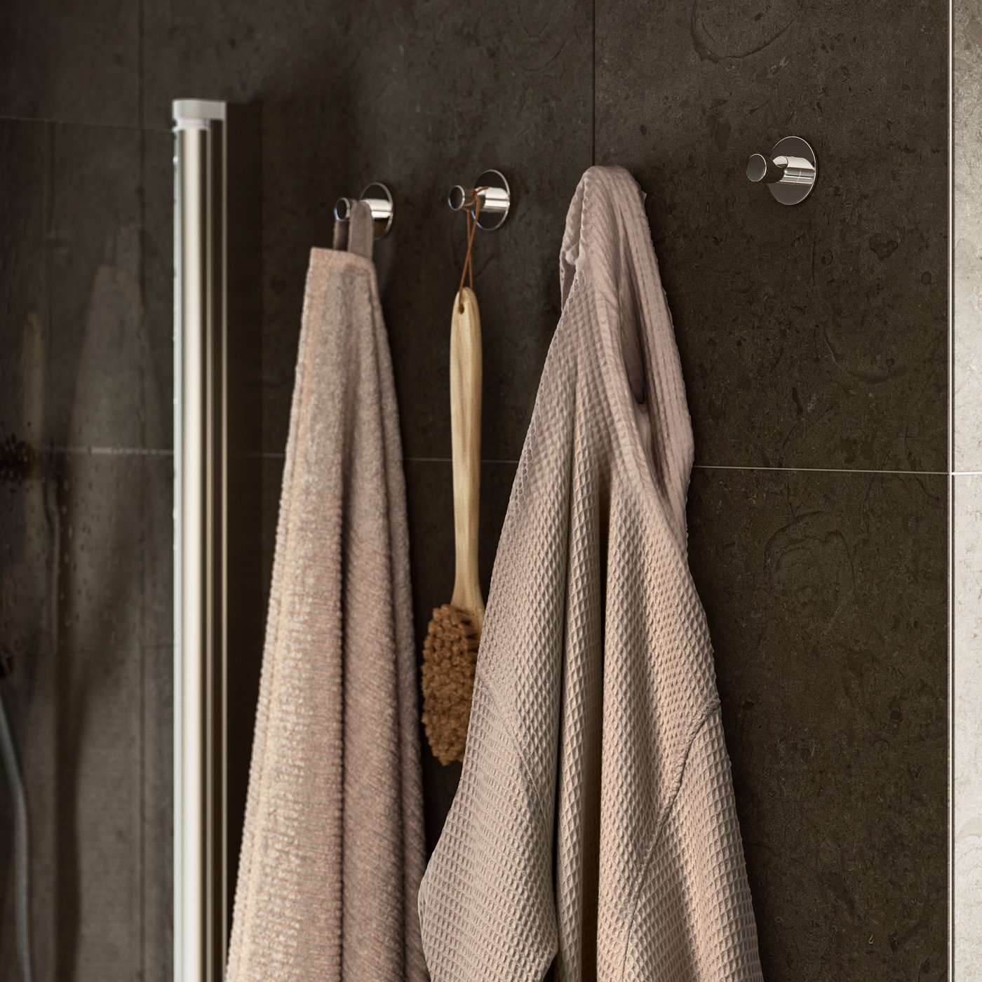 A chrome-plated VALLAMOSSE riser rail with handshower kit