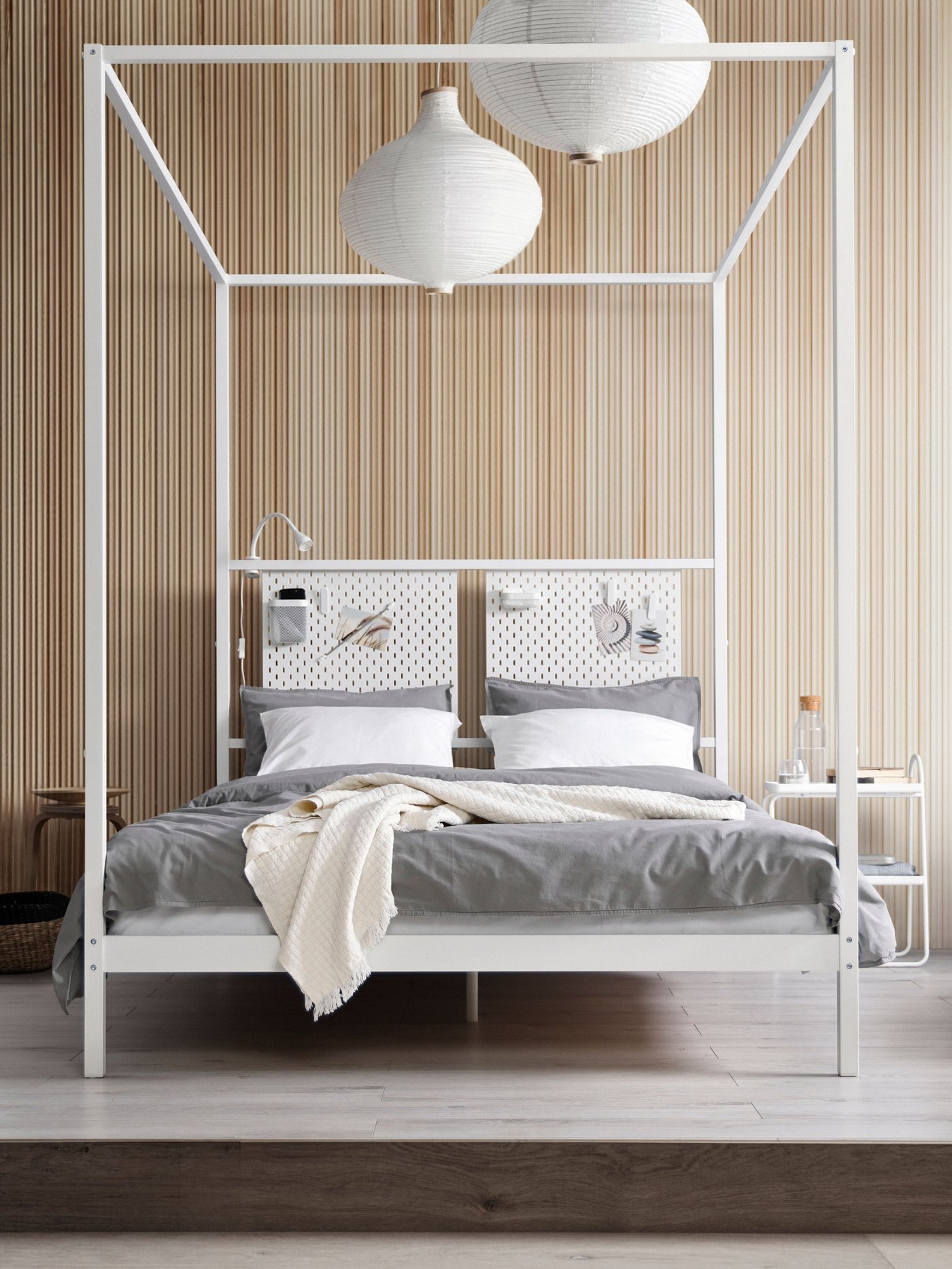 A white VITARNA four-poster bed frame
