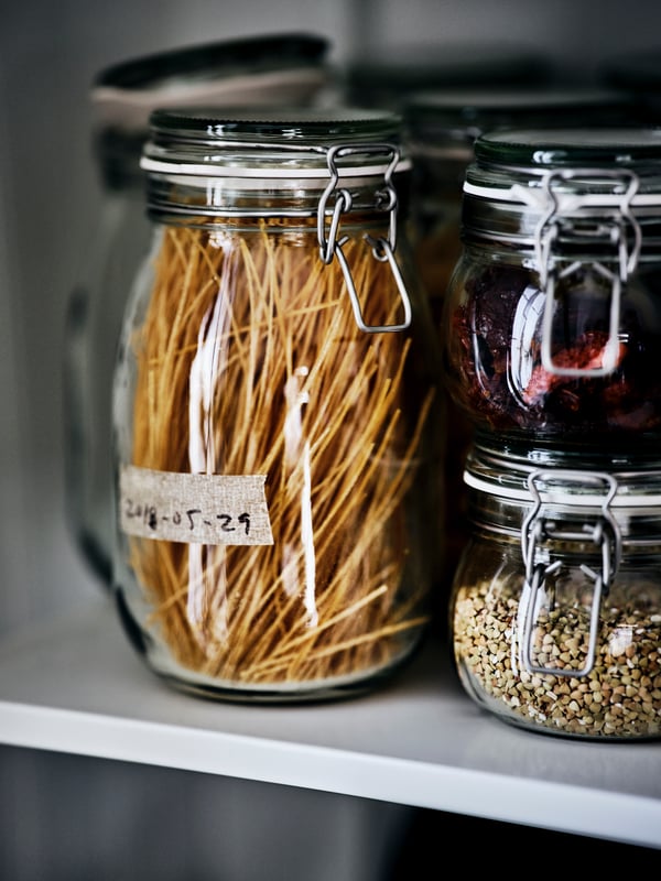 A clear glass KORKEN jar with lid in the kitchen