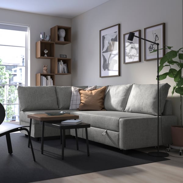 A Faringe light grey FRIHETEN seat section for corner sofa-bed in the living room