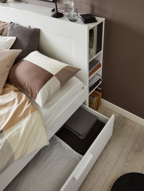 A white/Luröy BRIMNES bed frame w storage and headboard in the bedroom