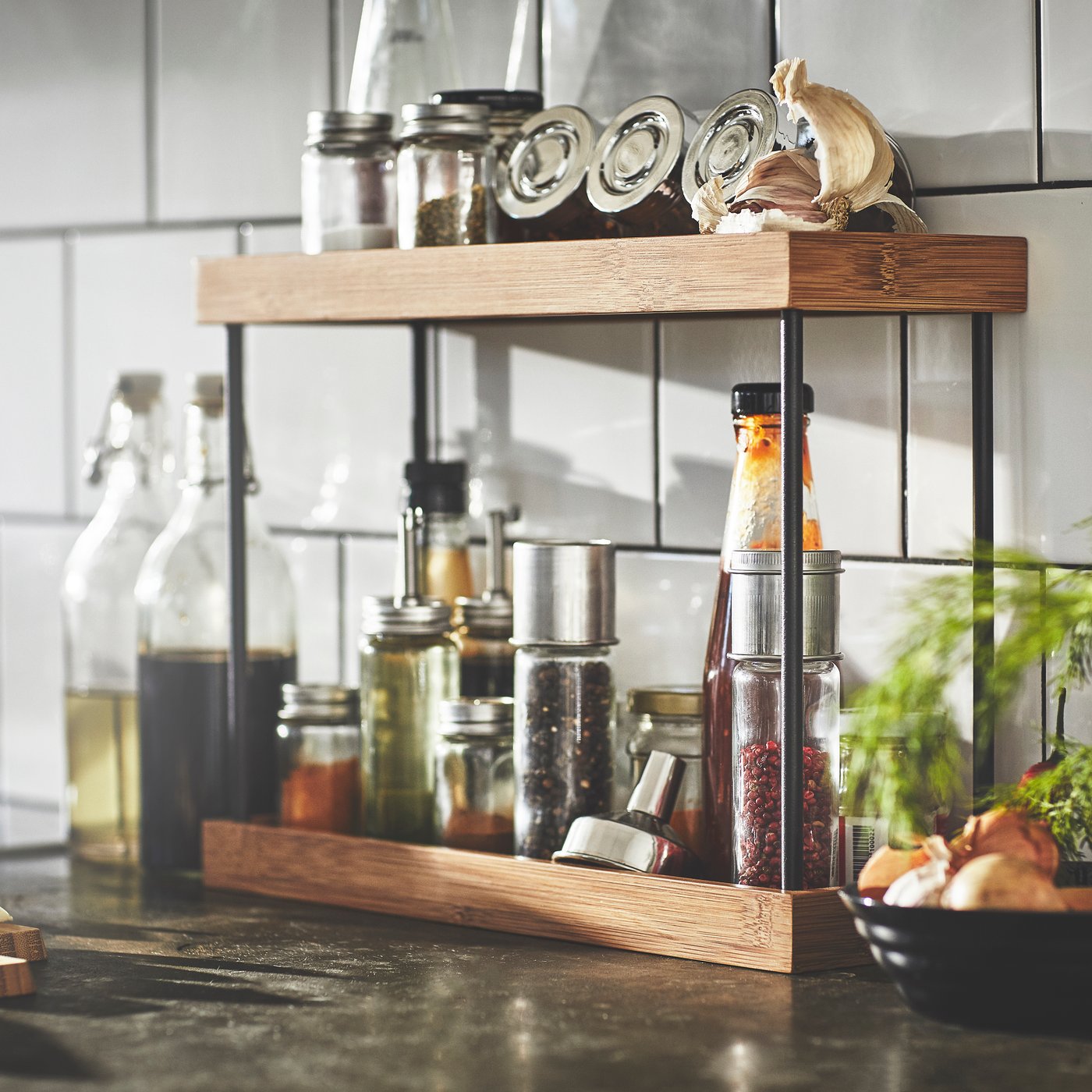 A metal/bamboo NÅLBLECKA kitchen countertop organiser