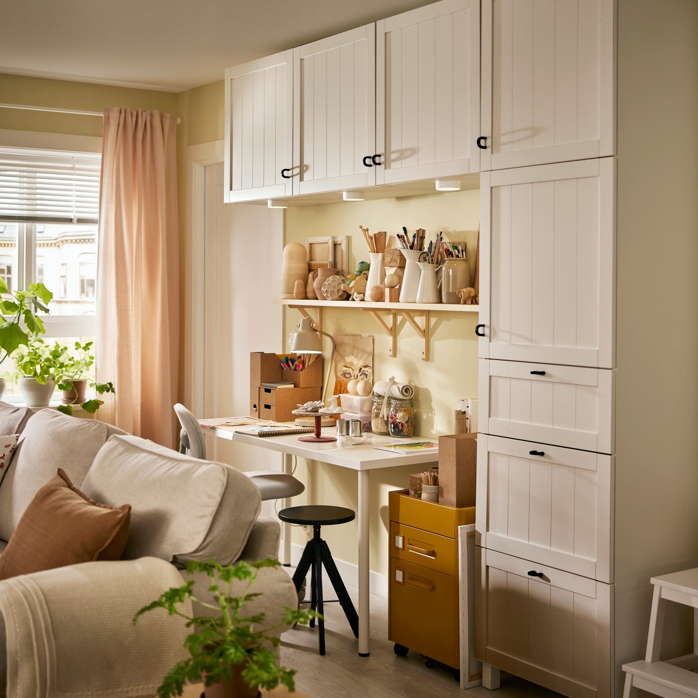 BESTÅ storage is mounted on the wall around a LAGKAPTEN / ADILS desk and two TRANHULT / SANDSHULT wall shelves.