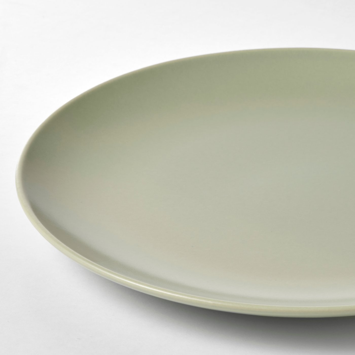 A matt green FÄRGKLAR plate in the NA