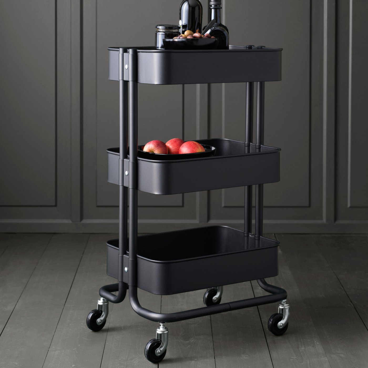 A black RÅSKOG trolley in the kitchen
