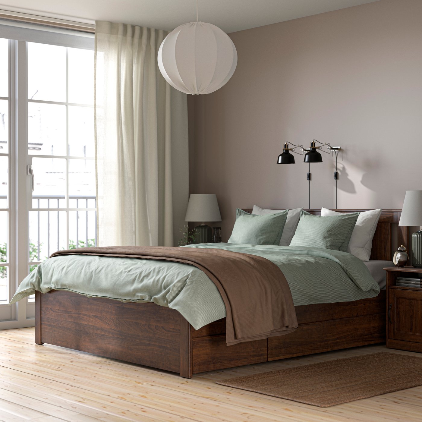 A brown SONGESAND bed frame with 4 storage boxes in the bedroom