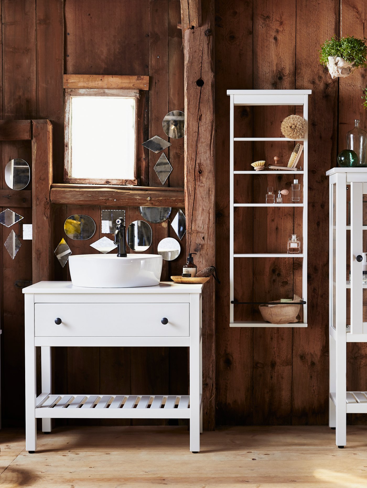 A white HEMNES wall shelf in the bathroom