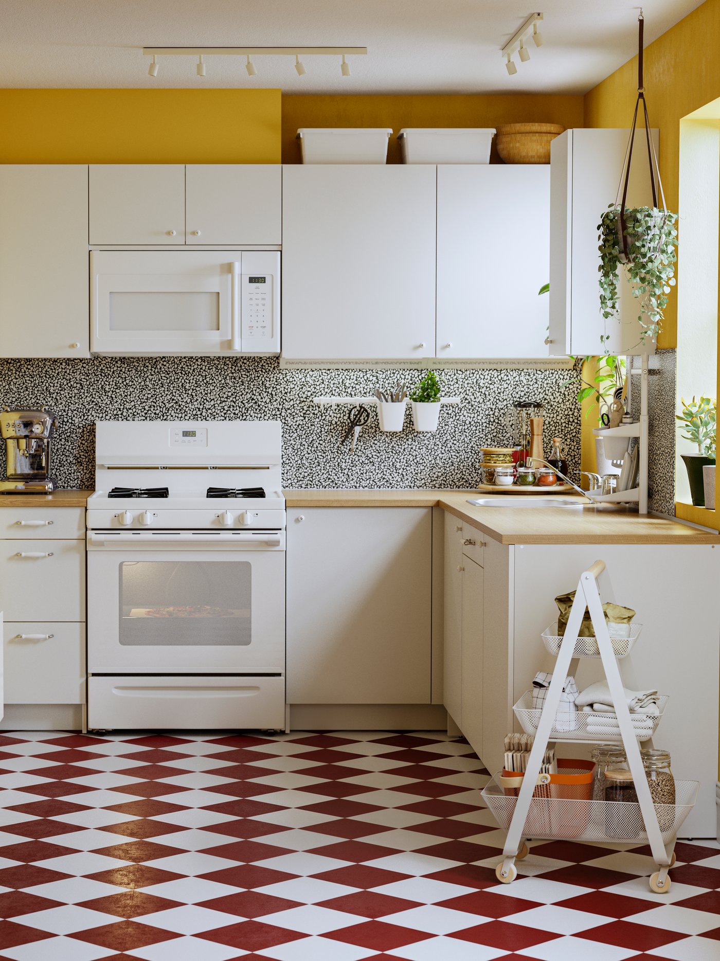 A small open-plan kitchen fitted with modules from the KNOXHULT series in white with a RISATORP trolley in white to one side.
