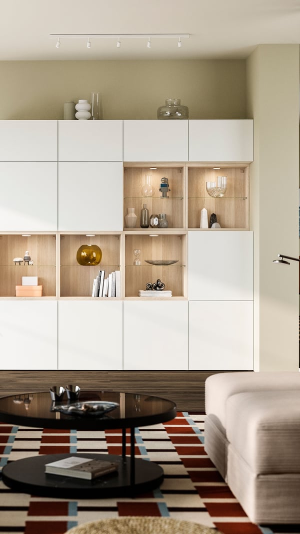 A white stained oak/Lappviken white BESTÅ storage combination with doors in the living room