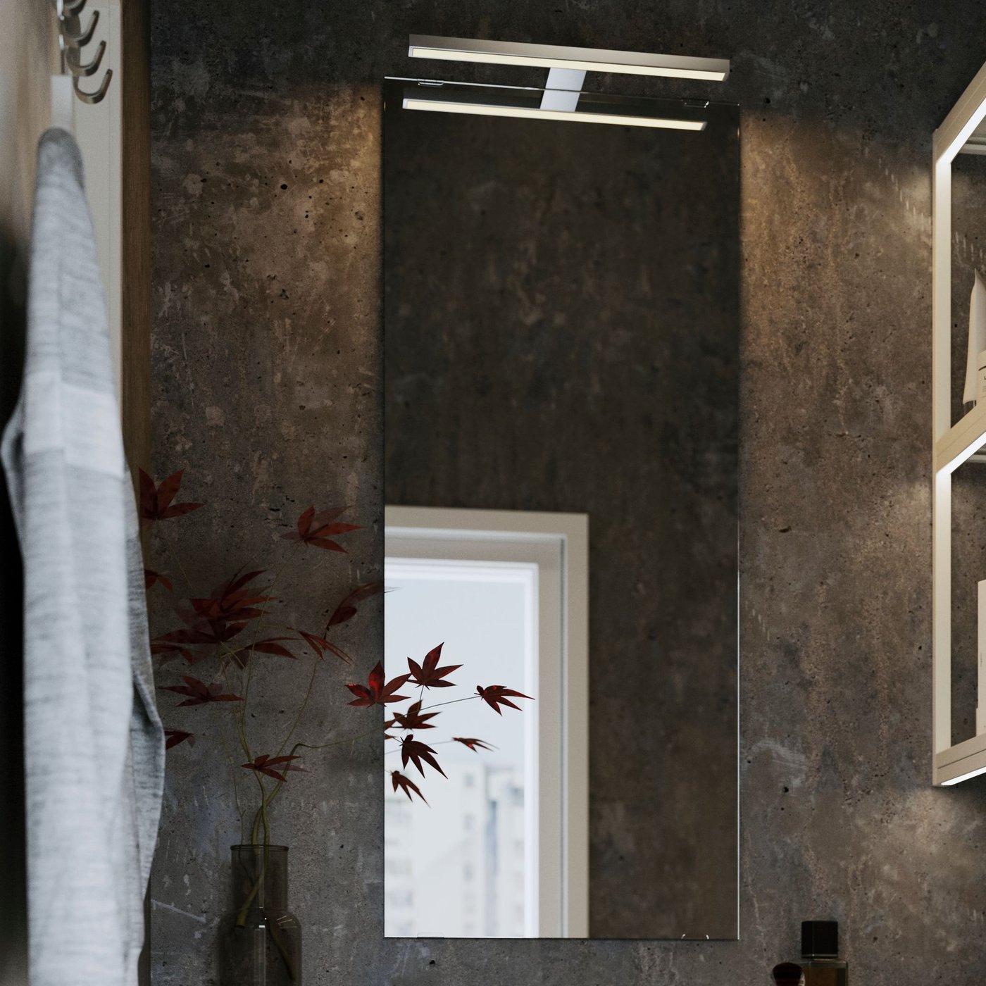 An aluminium-colour VÅTHULT LED cab/mirror light in the bathroom