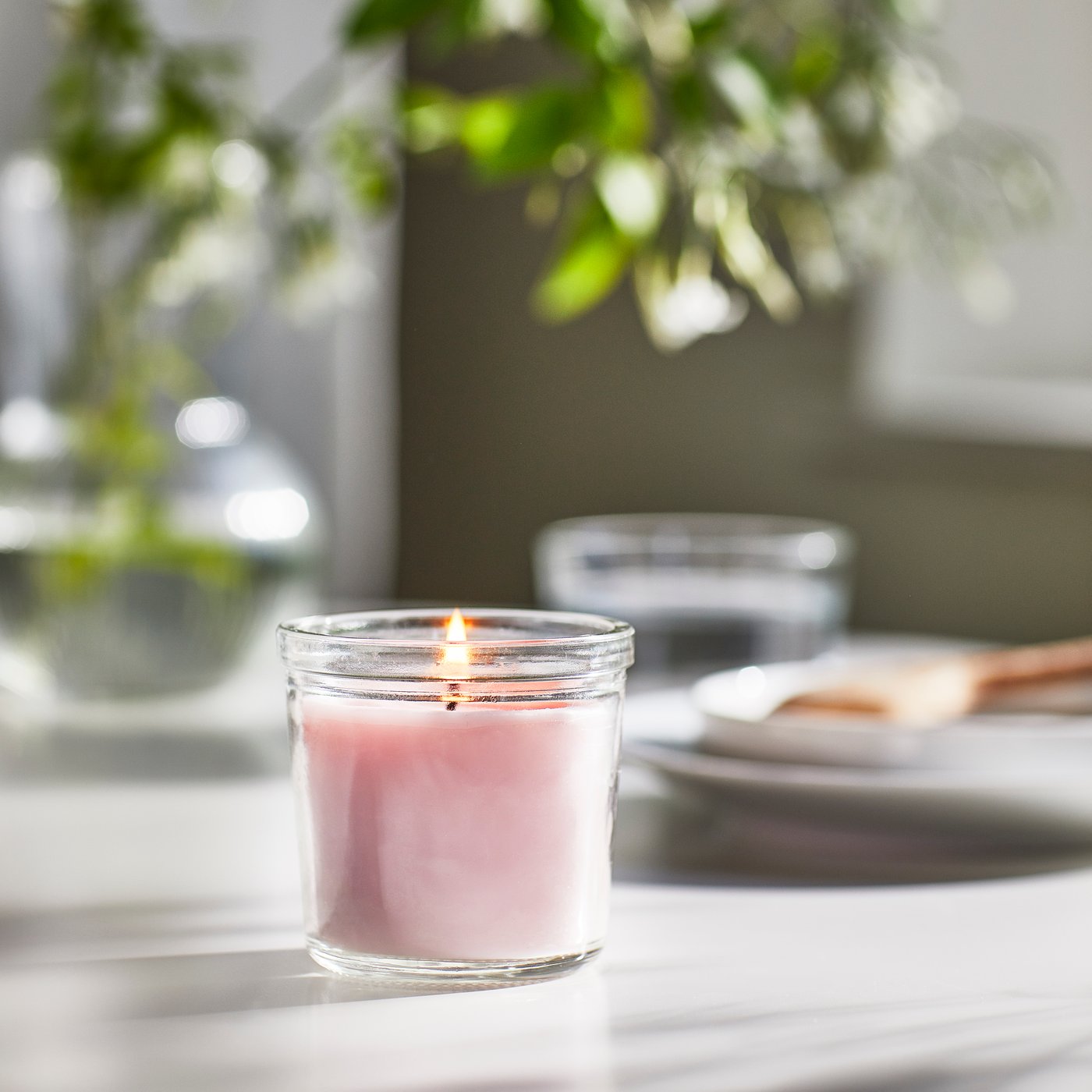 A Jasmine/pink LUGNARE scented candle in glass