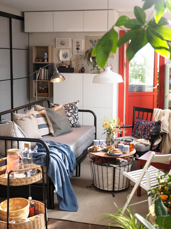 A small, busy space with a FYRESDAL sofa bed.