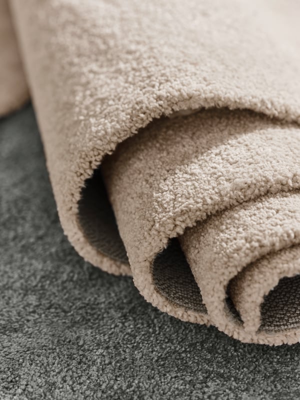 An off-white STOENSE rug, low pile