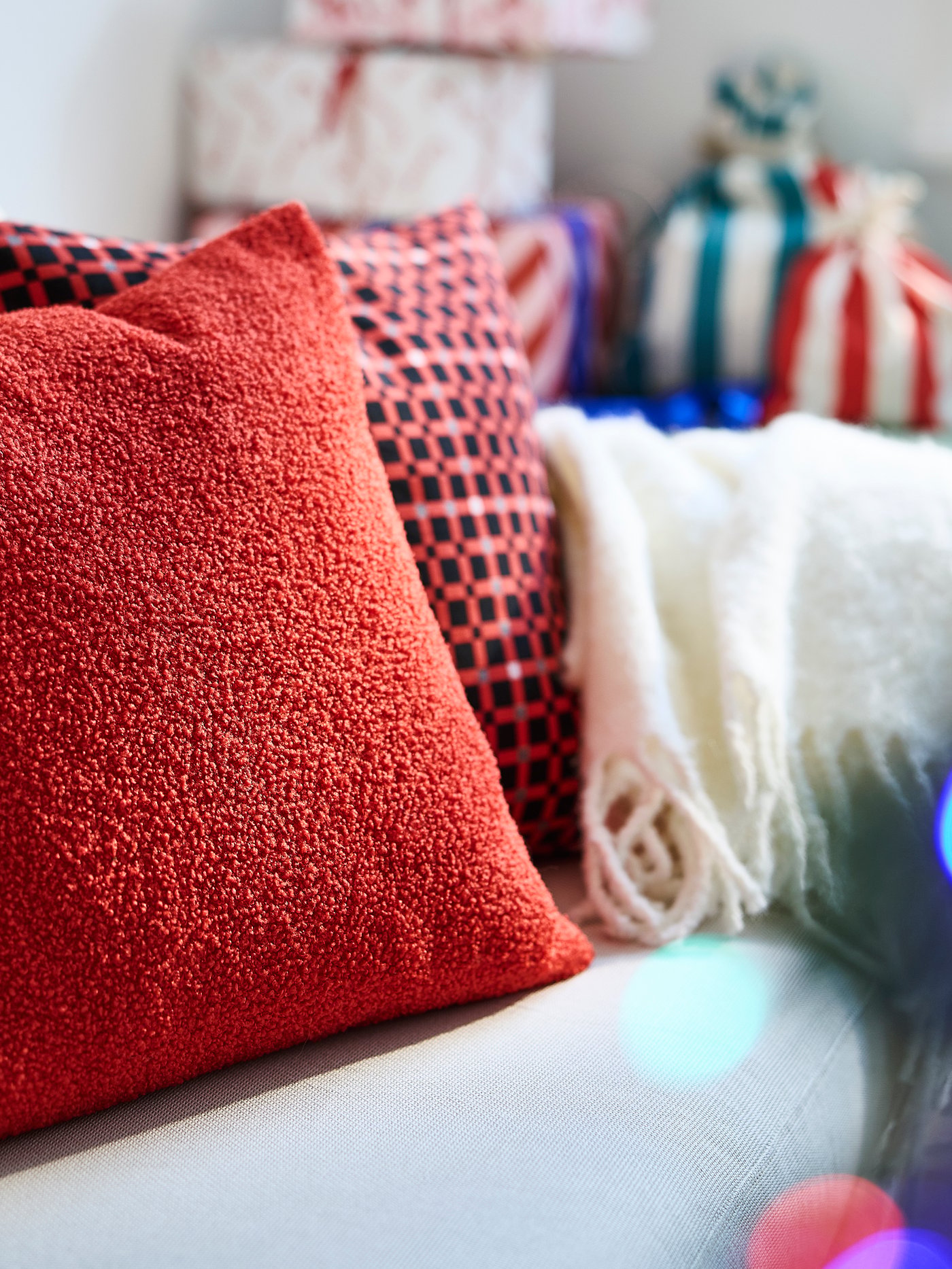 A check pattern red VINTERFINT cushion cover in the living room