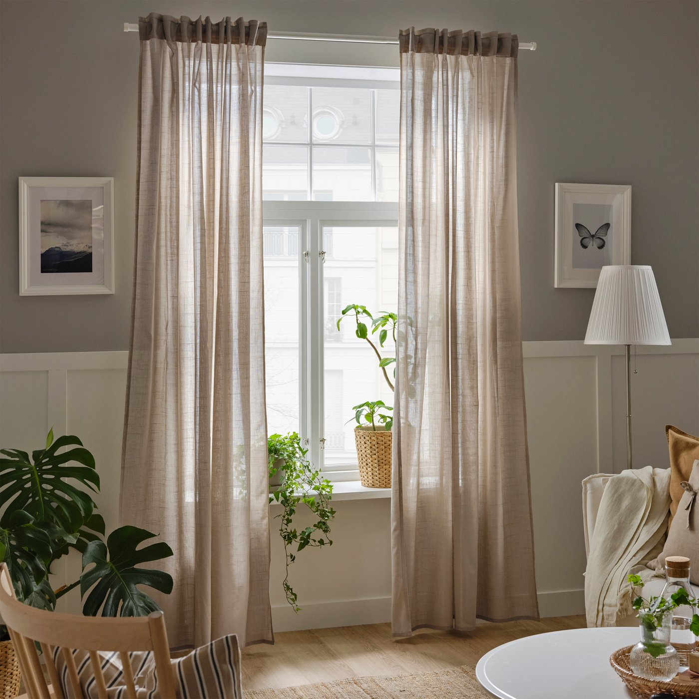 A beige/with heading tape SILVERLÖNN sheer curtains, 1 pair in the living room