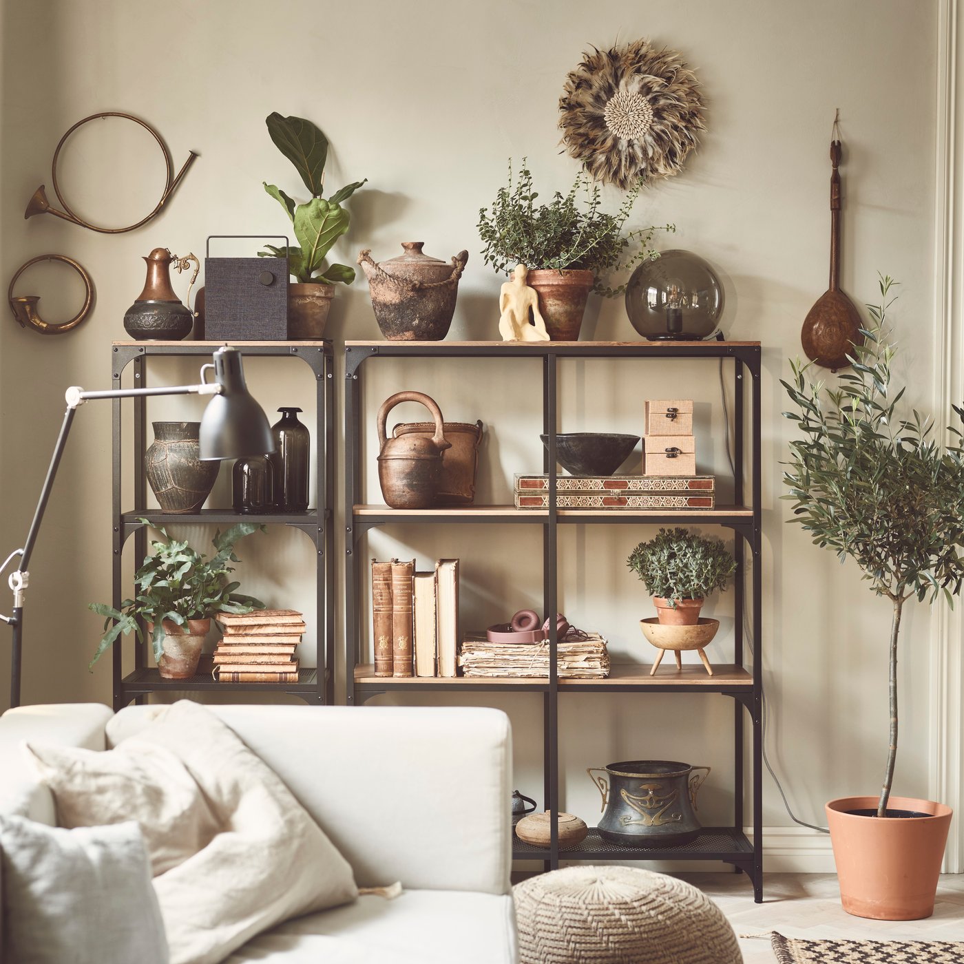 A black FJÄLLBO shelving unit in the living room