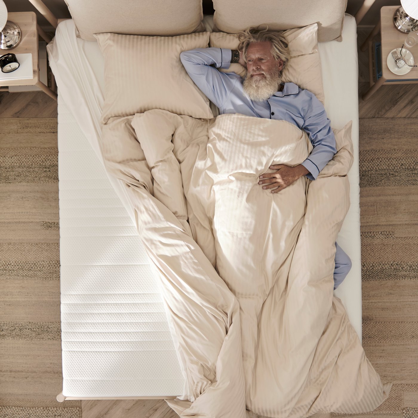 A firm/white ÅNNELAND hybrid mattress