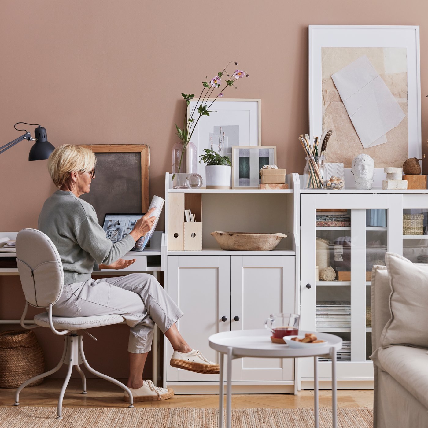 A white HAUGA cabinet with 2 doors