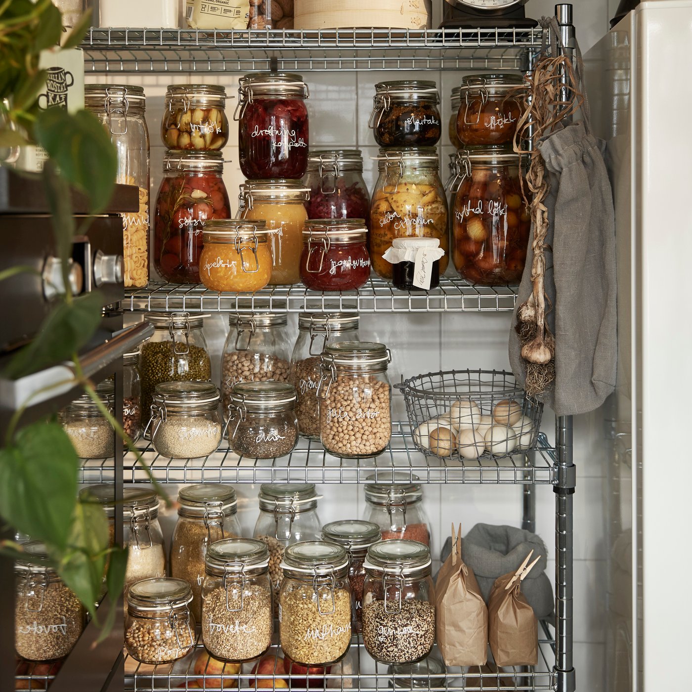 A clear glass KORKEN jar with lid