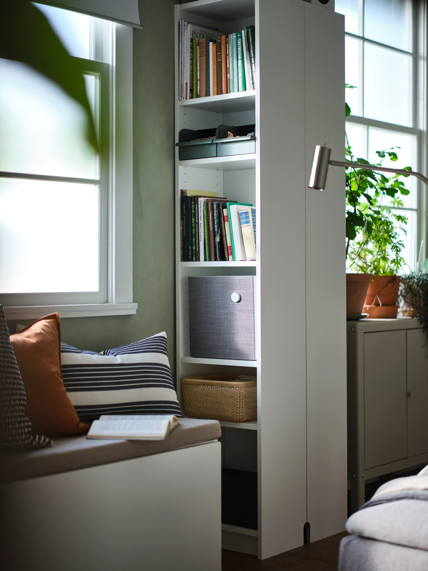 A grey-green/metal REJSA box in the living room