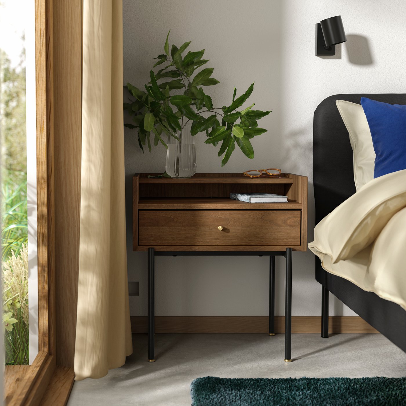 A brown walnut effect RÅDMANSÖ bedside table