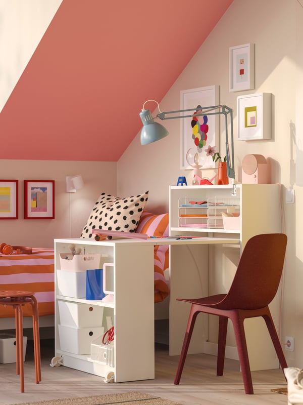A white BILLY bookcase with foldable table