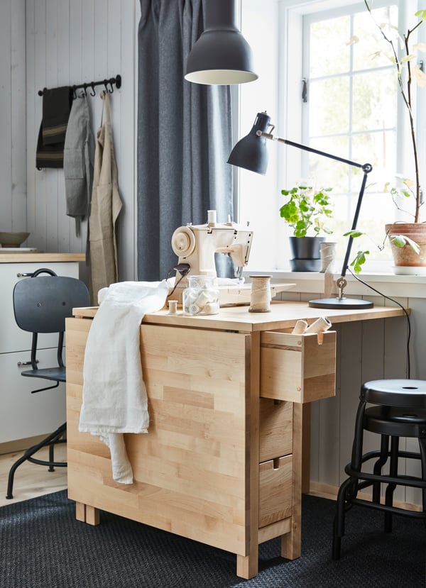 A black RÅSKOG stool in the home office